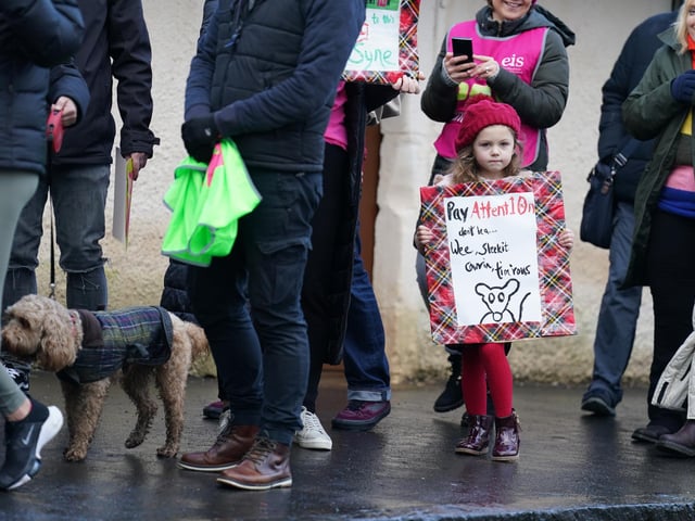 Ella Limardi, 5, joins striking teachers from the EIS to gather on the anniversary of Robert Burns' birth in 1759 outside the cottage in Alloway, Ayrshire, where he was born, as a rolling programme of regional action reaches its halfway point, with teachers in both South Ayrshire and Edinburgh taking strike action in a dispute over pay.