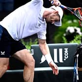 Andy Murray smashes his racket in anger after losing once again to Alex de Minaur.