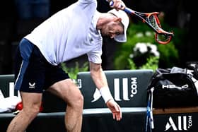 Andy Murray smashes his racket in anger after losing once again to Alex de Minaur.