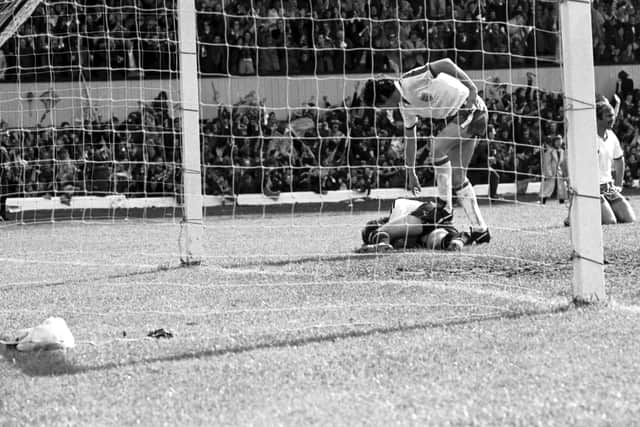 England goalkeeper Ray Clemence is consoled after allowing Kenny Dalglish's shot to squirm through his legs for Scotland's winning goal at Hampden in 1976. Picture: Allan Milligan