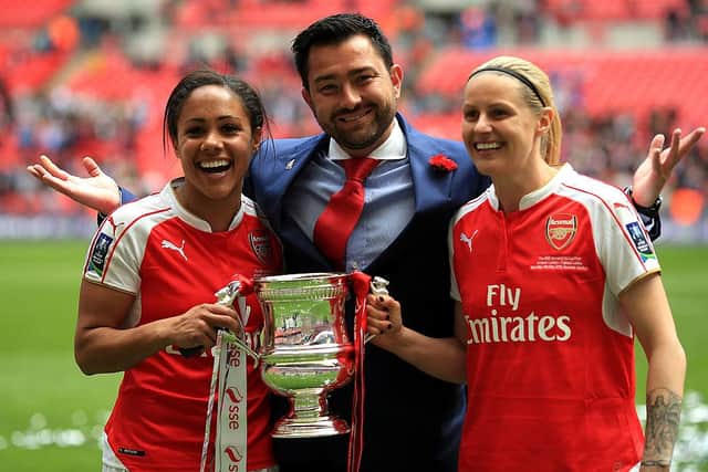 Arsenal manager Pedro Martinez Losa (C), Alex Scott (L) and Kelly Smith (R) celebrate with the trophy following the SSE Women's FA Cup Final between Arsenal Ladies and Chelsea Ladies at Wembley Stadium on May 14, 2016.  (Photo by Ben Hoskins/Getty Images)
