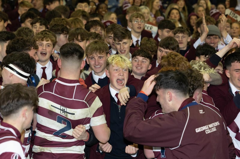 George Watson's players celebrate with fans at full time after winning the Scottish Schools U-18 Cup Final against Stewart's Melville College at Murrayfield.