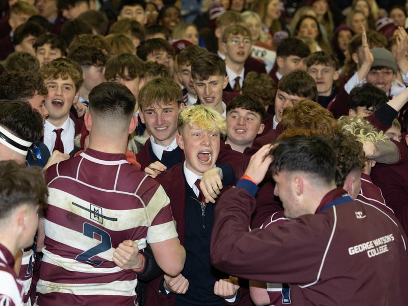 George Watson's players celebrate with fans at full time after winning the Scottish Schools U-18 Cup Final against Stewart's Melville College at Murrayfield.