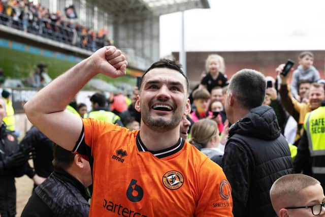 Dundee United's Tony Watt celebrates after fans invade the pitch at full-time following the 1-0 win over Ayr United that has effectively sealed the Championship title.  (Photo by Mark Scates / SNS Group)