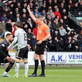 St Mirren defender Charles Dunne is sent off by referee David Dickinson for fouling Celtic