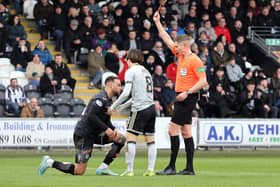 St Mirren defender Charles Dunne is sent off by referee David Dickinson for fouling Celtic