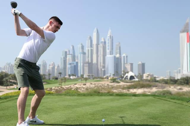 Liverpool and Scotland left-back Andrew Robertson hits his tee shot at the eighth on the Majlis Course at Emirates Golf Club during one of the pro-ams for the Slync.io Dubai Desert Classic. Picture Warren Little/Getty Images.