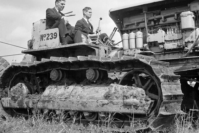 Lord Polwarth at the controls of an earth moving machine at the turf cutting ceremony for the North British Rubber Company's new factory in June 1965.