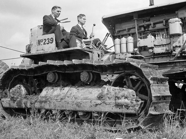 Lord Polwarth at the controls of an earth moving machine at the turf cutting ceremony for the North British Rubber Company's new factory in June 1965.