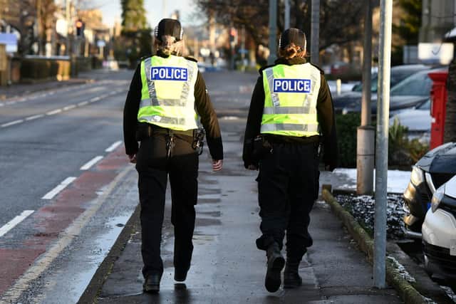 Two Police Scotland officers on foot patrol. Picture: Michael Gillen.
