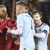 Armenia's Varazdat Haroyan, left, argues with Scotland's Scott McTominay during the match in Yerevan.