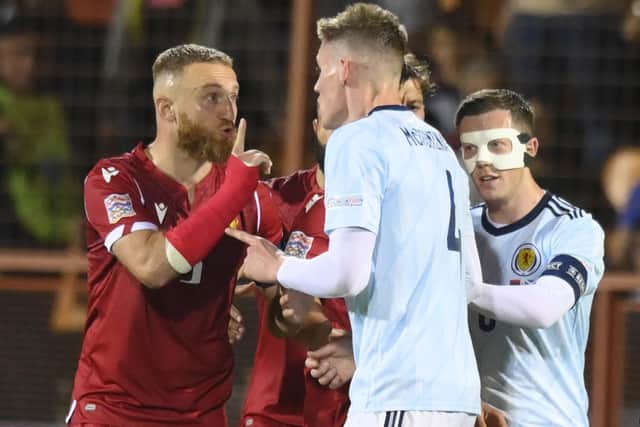 Armenia's Varazdat Haroyan, left, argues with Scotland's Scott McTominay during the match in Yerevan.