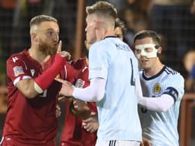 Armenia's Varazdat Haroyan, left, argues with Scotland's Scott McTominay during the match in Yerevan.