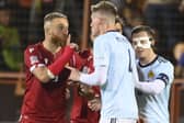 Armenia's Varazdat Haroyan, left, argues with Scotland's Scott McTominay during the match in Yerevan.