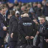 Everton interim manager Duncan Ferguson shakes hands with Aston Villa's head coach Steven Gerrard the English Premier League soccer match between Everton and Aston Villa at the Goodison Park stadium, in Liverpool, England, Saturday Jan. 22, 2022. (AP Photo/Jon Super)