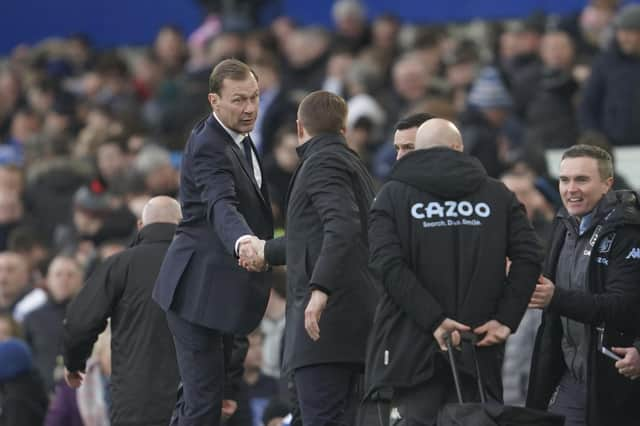 Everton interim manager Duncan Ferguson shakes hands with Aston Villa's head coach Steven Gerrard the English Premier League soccer match between Everton and Aston Villa at the Goodison Park stadium, in Liverpool, England, Saturday Jan. 22, 2022. (AP Photo/Jon Super)