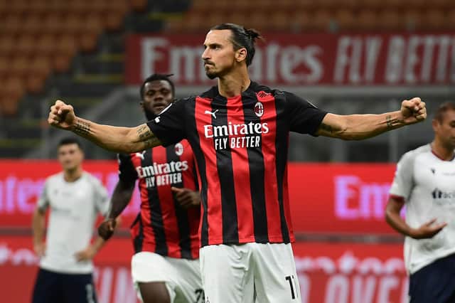 Zlatan Ibrahimovic celebrates scoring for AC Milan in this inimitable fashion (Photo by MIGUEL MEDINA/AFP via Getty Images)