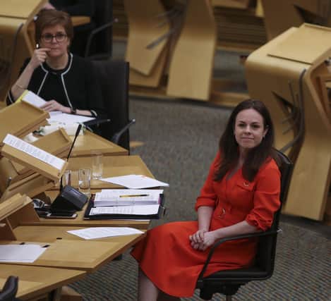 Finance secretary Kate Forbes reacts next to Nicola Sturgeon at Holyrood. Picture: Fraser Bremner - Pool/Getty Images