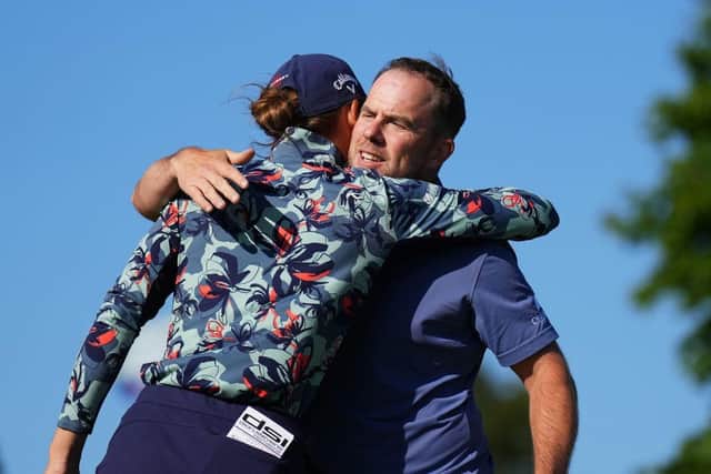 Richie Ramsay embraces playing partner Anne van Dam after the final round of the Volvo Car Scandinavian Mixed. Picture: Alcalde/Getty Images.