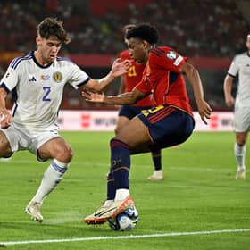 Scotland defender Aaron Hickey challenges Spain's Alejandro Balde during the Euro 2024 qualifier in Seville. (Photo by JAVIER SORIANO/AFP via Getty Images)