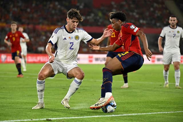 Scotland defender Aaron Hickey challenges Spain's Alejandro Balde during the Euro 2024 qualifier in Seville. (Photo by JAVIER SORIANO/AFP via Getty Images)
