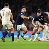 Huw Jones on the attack for Scotland at Twickenham, with Sione Tuipulotu in support. (Photo by Julian Finney/Getty Images)