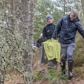 Grant Moir, CEO of CNPA, and Lorna Slater MSP carry female beaver to release site (Pic: Beaver Trust).