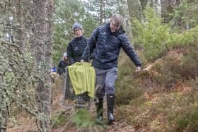 Grant Moir, CEO of CNPA, and Lorna Slater MSP carry female beaver to release site (Pic: Beaver Trust).