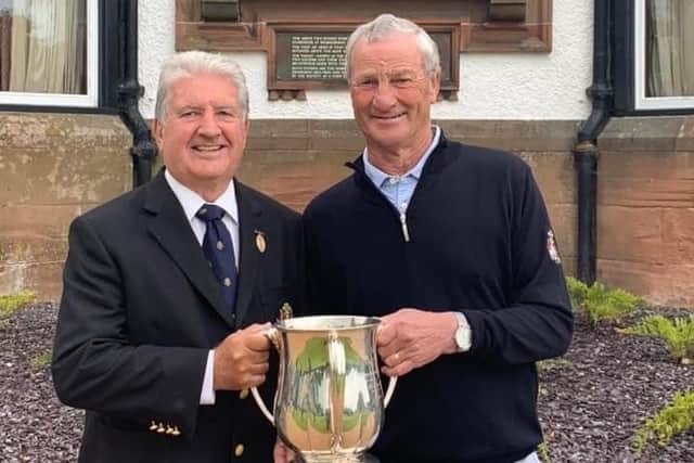 John Fraser, right, is presented with the trophy by Royal Burgess Golfing Society captain Martin Blencowe after his latest title triumph at the Barnton club.