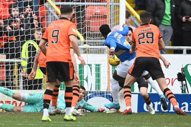 Rangers striker Fashion Sakala has his shirt pulled in the box by Dundee United's Ross Graham - no penalty was awarded but VAR would have intervened. (Photo by Rob Casey / SNS Group)