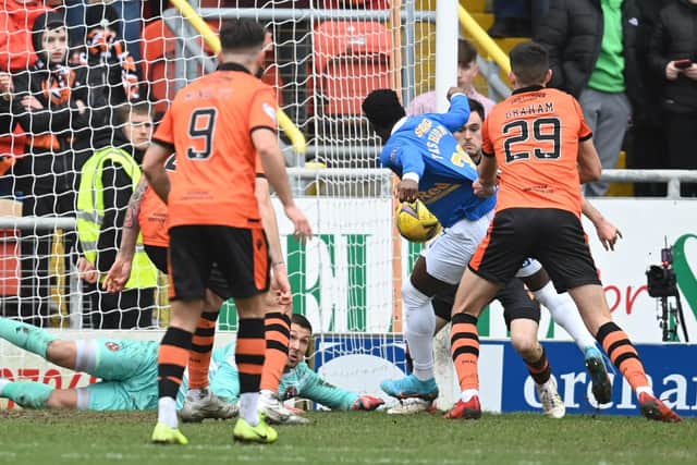 Rangers striker Fashion Sakala has his shirt pulled in the box by Dundee United's Ross Graham - no penalty was awarded but VAR would have intervened.  (Photo by Rob Casey / SNS Group)