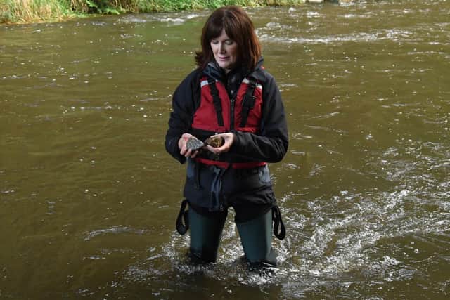 James Hutton Institute researcher Claire Newman takes samples from a Scottish river as part of the review into antibiotic-resistant superbugs