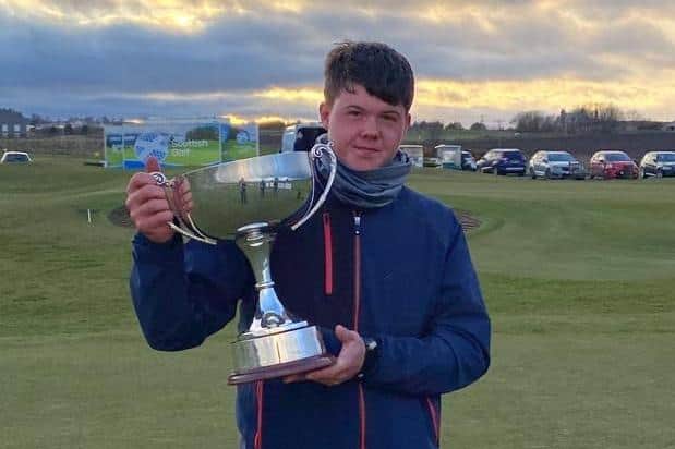 New Scottish Boys' Open champion Dylan Shaw-Radford shows off the trophy at Murcar Links. Picture: Scottish Golf