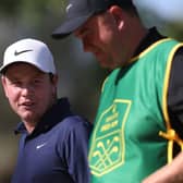 Bob MacIntyre speaks with his caddie, Mike Burrow, during the pro-am prior to the DP World Tour Championship on the Earth Course at Jumeirah Golf Estates in Dubai. Picture: Oisin Keniry/Getty Images.