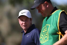 Bob MacIntyre speaks with his caddie, Mike Burrow, during the pro-am prior to the DP World Tour Championship on the Earth Course at Jumeirah Golf Estates in Dubai. Picture: Oisin Keniry/Getty Images.