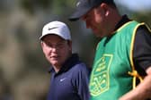 Bob MacIntyre speaks with his caddie, Mike Burrow, during the pro-am prior to the DP World Tour Championship on the Earth Course at Jumeirah Golf Estates in Dubai. Picture: Oisin Keniry/Getty Images.