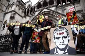 Demonstrators hold placards as they protest against the expansion of the Ultra Low Emission Zone (ULEZ) in London. Picture: Henry Nicholls/AFP via Getty Images