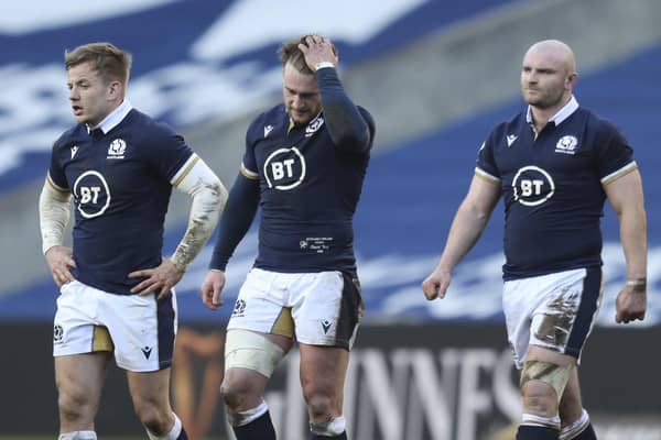 Scotland's Stuart Hogg, centre, reacts at the end of the Six Nations rugby union match between Scotland and Ireland at Murrayfield, Edinburgh, Scotland, Sunday, March 14, 2021. Ireland won the game 27-24. (Jane Barlow/Pool Via AP)