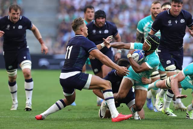 Scotland's Duhan van der Merwe takes down South Africa's Kurt-Lee Arendse during the World Cup clash in Marseille.
