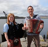 Gary Innes, BBC Scotland presenter and founding member of Scottish supergroup Mànran, launches Scottish Folk Day with piper Katie McEwan of Oban High School Pipe Band, who are just back from New York’s Tartan Week. Picture: Kevin McGlynn