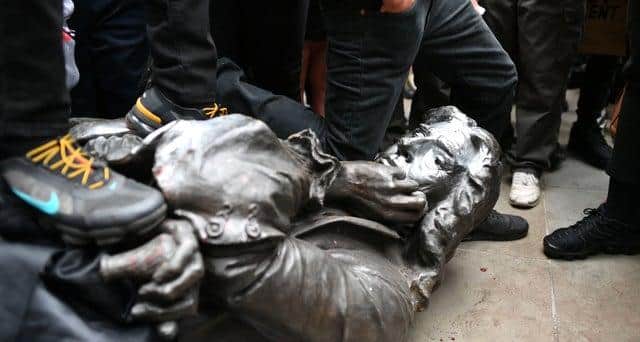 The statue of Edward Colston after it was pulled down during a Black Lives Matter rally in Bristol