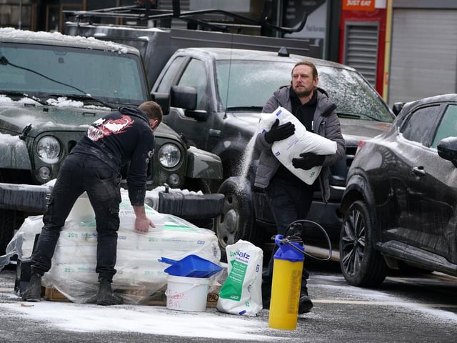 Set Dressers dress the set with fake snow on the set in Glasgow, for what is believed to be the film set of the new Batgirl movie. (Photo: Andrew Milligan/PA Wire).