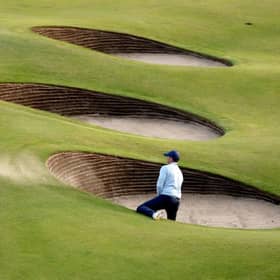 Rory McIlroy needed two attempts to escape from a greenside bunker at the 18th in his opening round in the 151st Open at Royal Liverpool. Picture: Warren Little/Getty Images.