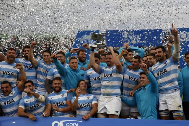Captain Julian Montoya holds up the trophy as Argentina celebrate their 26-18 win over Scotland. (Photo by Daniel Jayo/Getty Images)