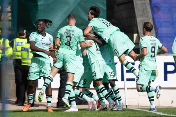 Hibs celebrate the winning goal against St Johnstone at McDiarmid Park.