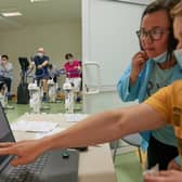 Health workers in Poland are developing physical rehabilitation programmes to help long Covid patients, with virtual reality games used to test their reaction skills (Picture: Bartosz Siedlik/AFP via Getty Images)