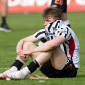 Coll Donaldson is dejected at full-time as Dunfermline are relegated to League One. (Photo by Sammy Turner / SNS Group)