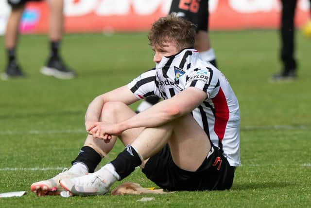 Coll Donaldson is dejected at full-time as Dunfermline are relegated to League One. (Photo by Sammy Turner / SNS Group)