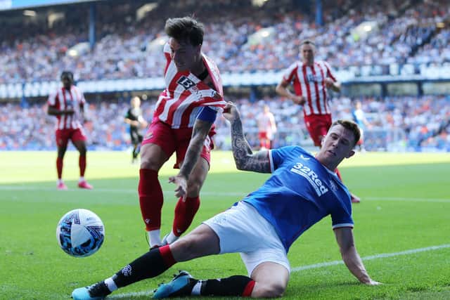 St Johnstone's Melker Hallberg and Rangers' Ryan Jack (right) battle for the ball (Picture: Robert Perry/PA Wire)