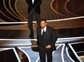 US actor Will Smith (R) walks away after slaping US actor Chris Rock onstage during the 94th Oscars at the Dolby Theatre in Hollywood, California on March 27, 2022. (Photo by Robyn Beck / AFP) (Photo by ROBYN BECK/AFP via Getty Images)